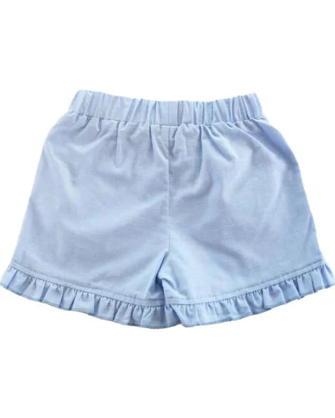 Light blue shorts with ruffled hem on a white background