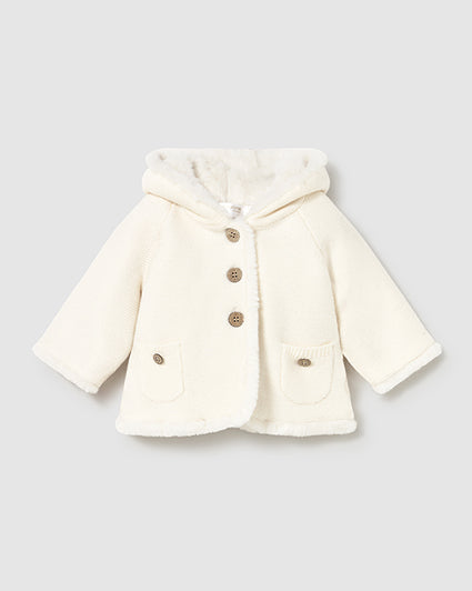White coat with gold buttons on a light gray background