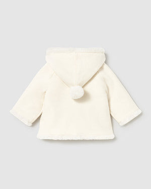 White baby coat with a hood on a light gray background