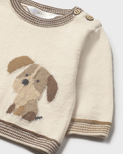 Knitted sweater with a dog design on a white background