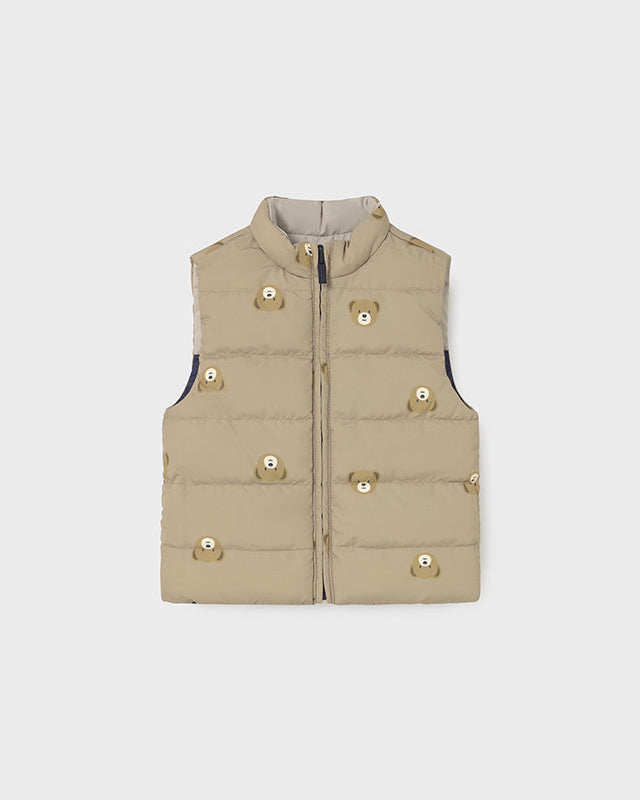 Beige puffer vest on a light gray background