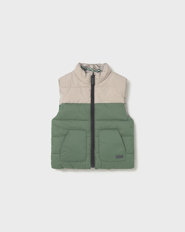 Two-tone puffer vest with beige top and green bottom on a white background