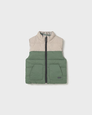 Two-tone puffer vest with beige top and green bottom on a white background