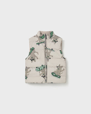 Children's puffer vest with animal print on a white background