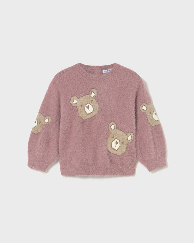 Pink sweater with bear patches on a light gray background
