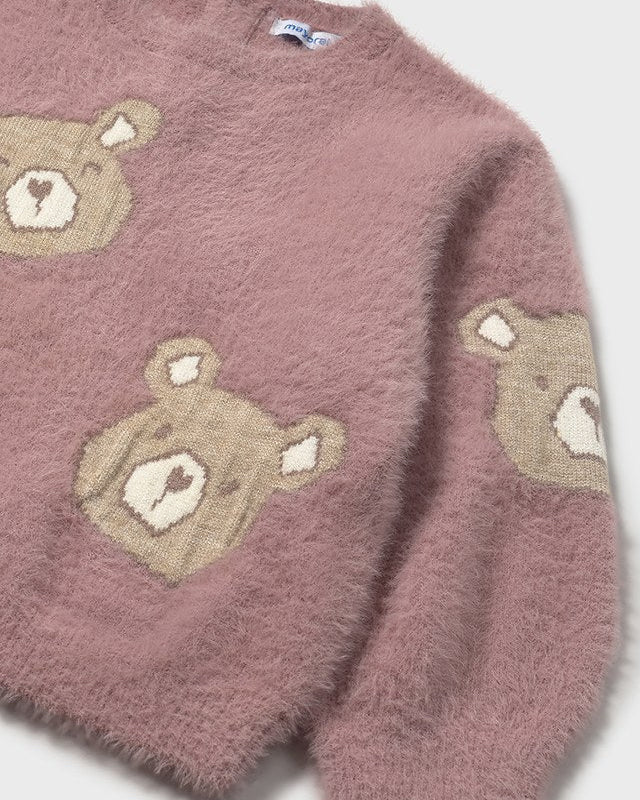 Pink sweater with bear face patterns on a white background