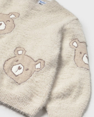 Beige sweater with teddy bear patterns on a white background