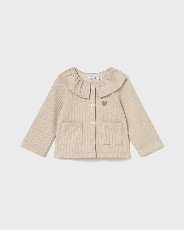 Beige ribbed sweater with a frilled collar on a white background