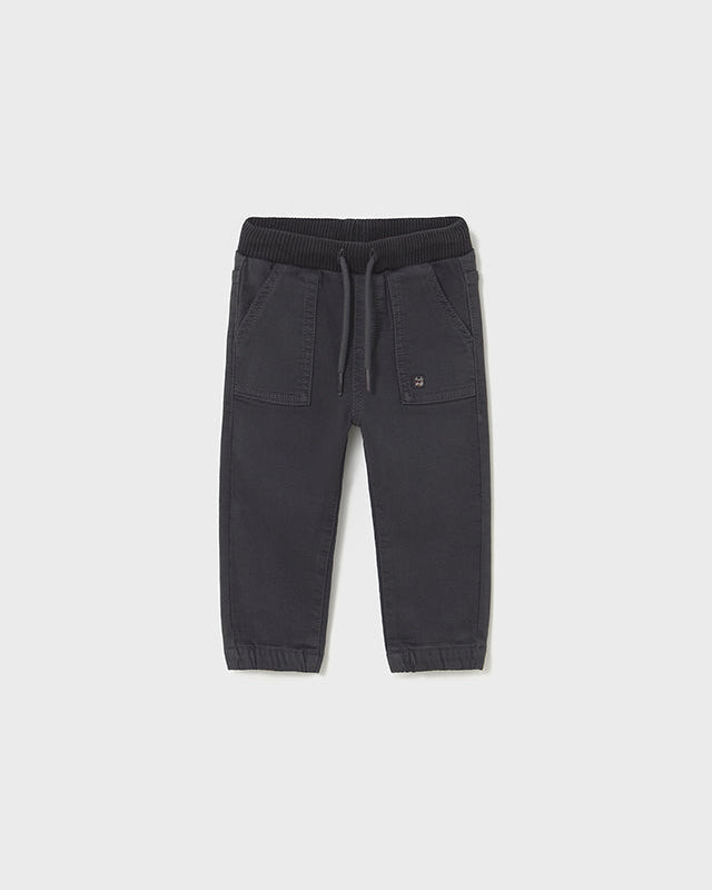 Dark gray jogger pants on a light gray background