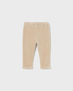 Beige corduroy pants on a white background