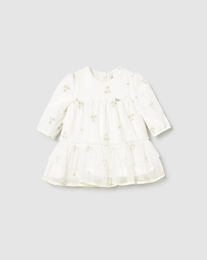 White dress with floral pattern on a light gray background