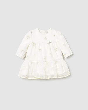 White dress with floral pattern on a light gray background