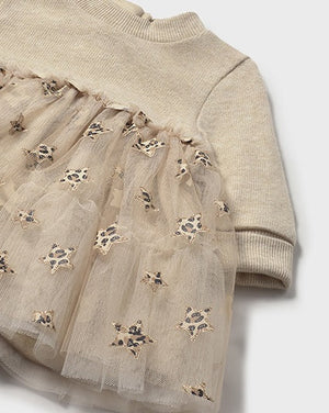Beige sweater with tulle overlay and embroidered star details on a white background
