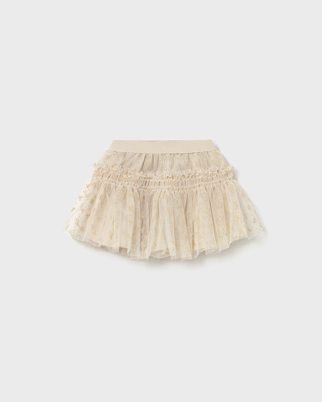 Beige tulle skirt on a white background