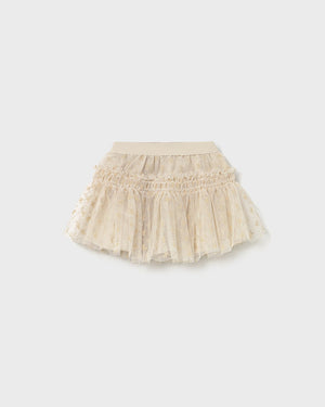 Beige tulle skirt on a white background