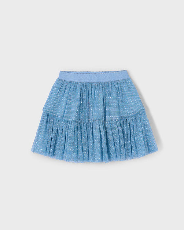 Blue tiered skirt on a light gray background