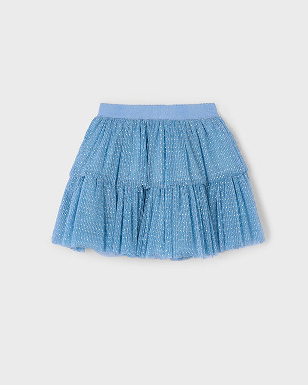 Blue tiered skirt on a light gray background