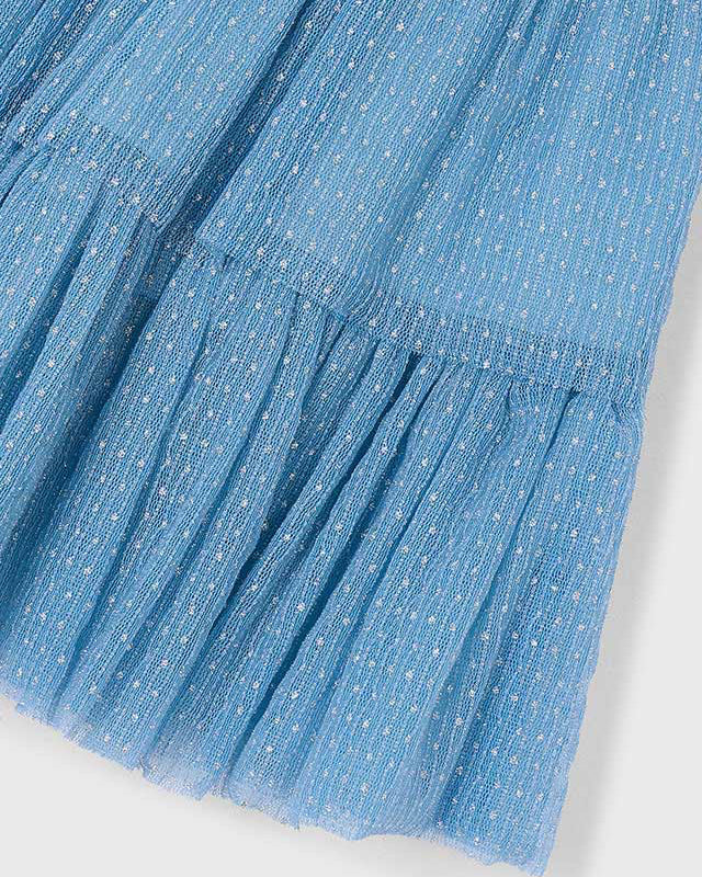 Close-up of a blue textured fabric with a white background