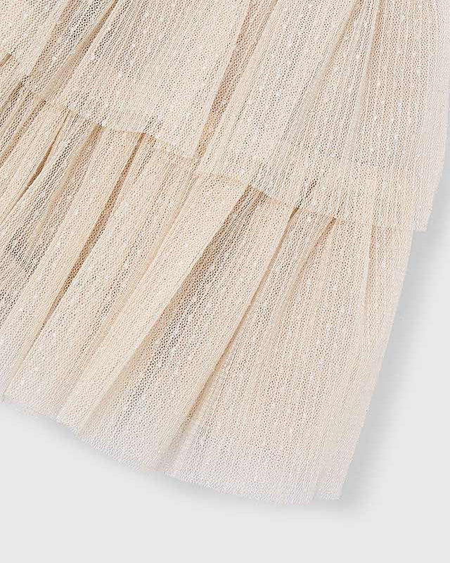 Close-up of a textured beige fabric on a white background