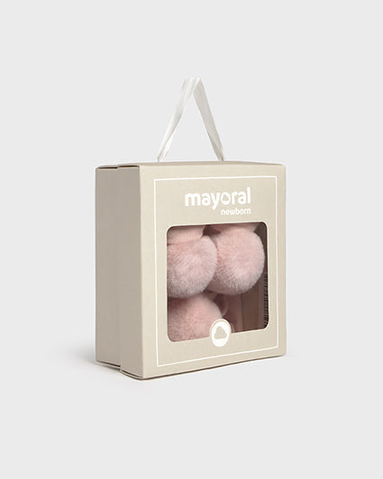 Box of pink pom-poms with 'mayoral' branding on a light gray background