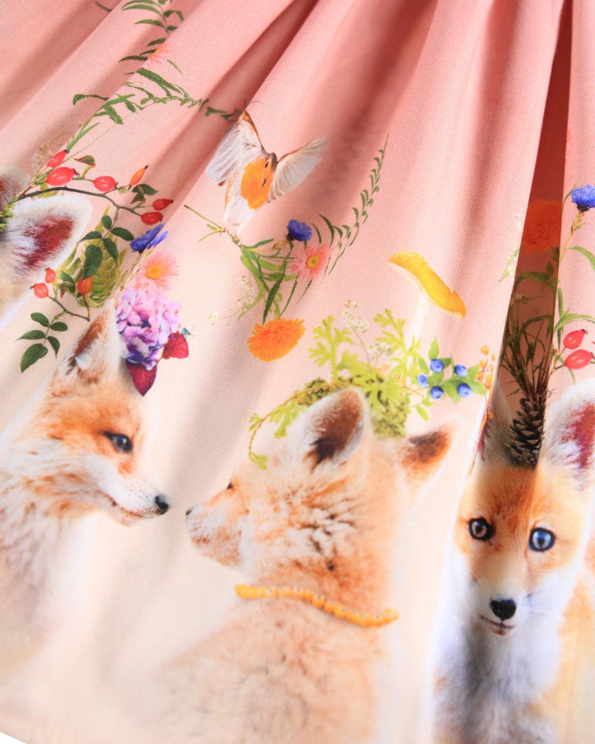 Fabric with fox and floral pattern on a pink background