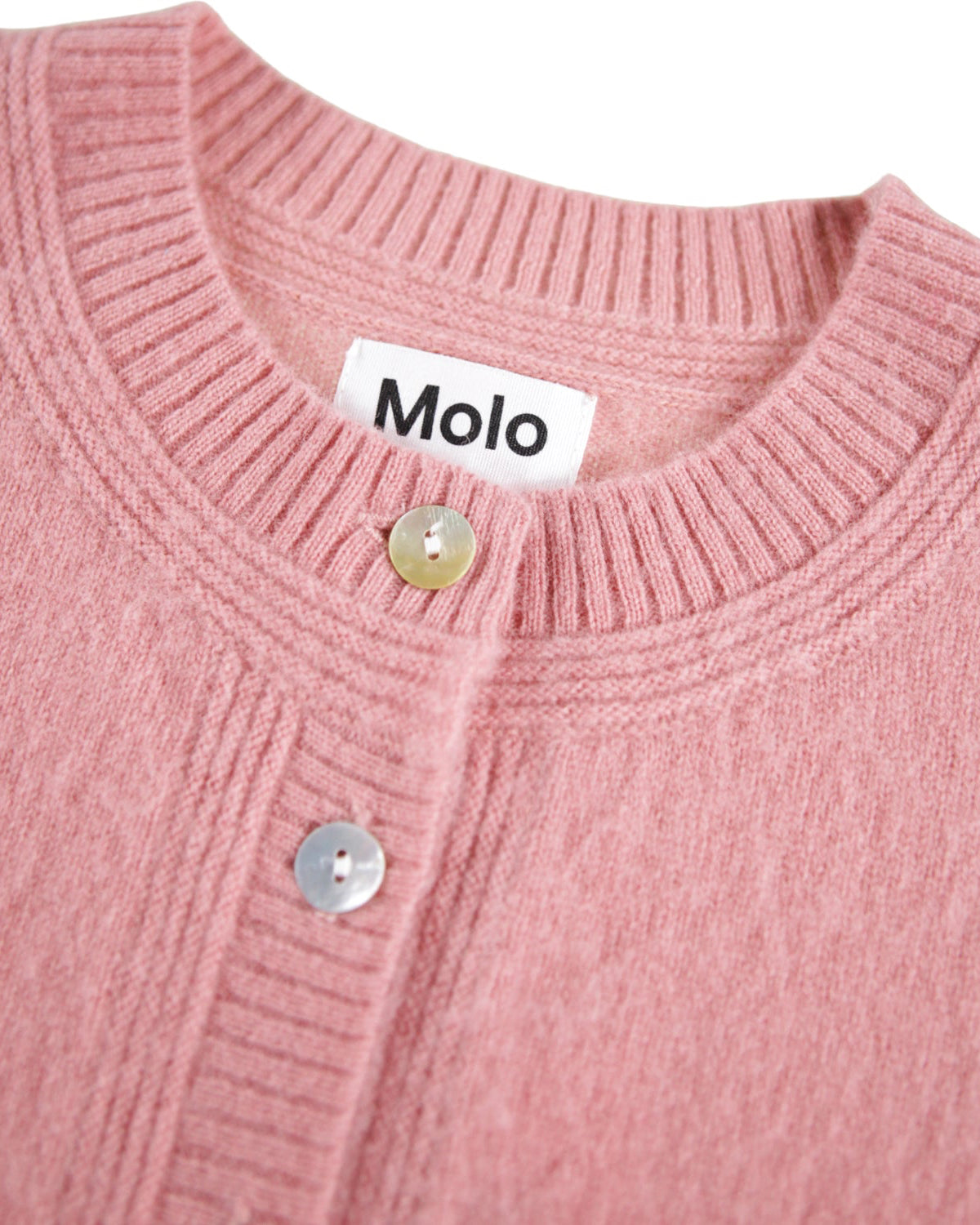 Close-up of a pink cardigan with 'Molo' brand label on a white background