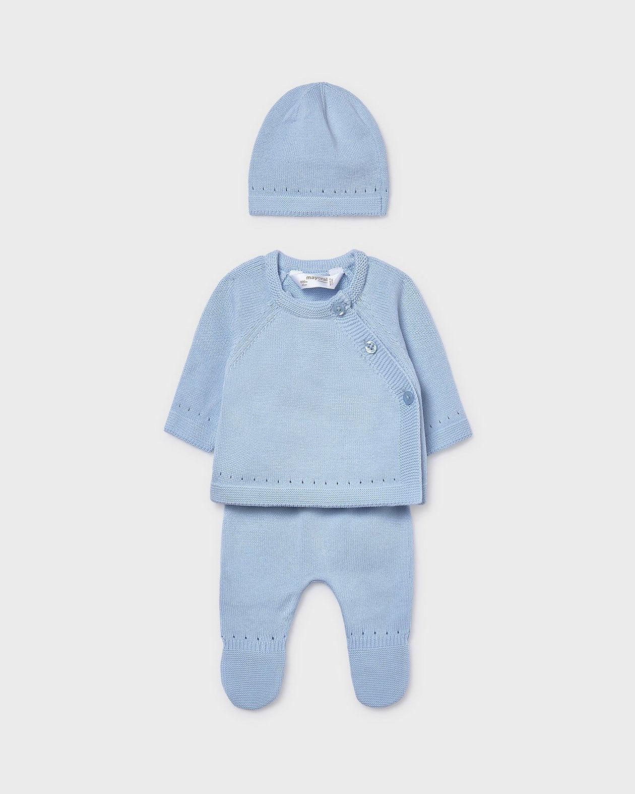 Blue baby outfit with top, pants, and hat on a light gray background