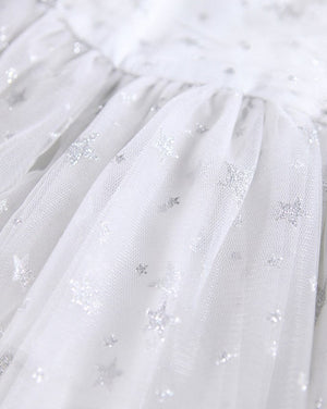 Close-up of a white tulle skirt with star-shaped sequins on a white background