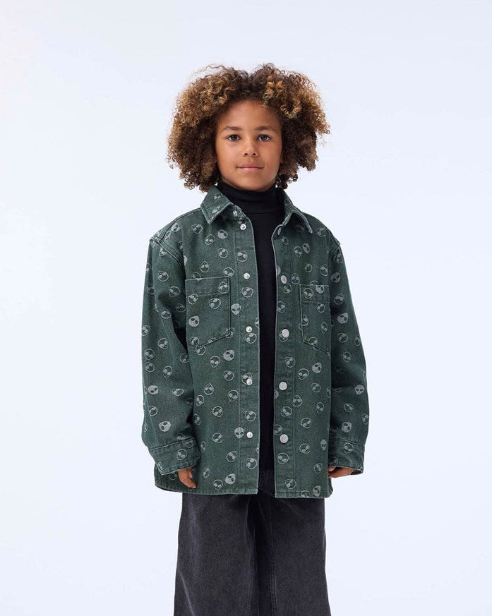 Child wearing a green floral-patterned jacket on a white background