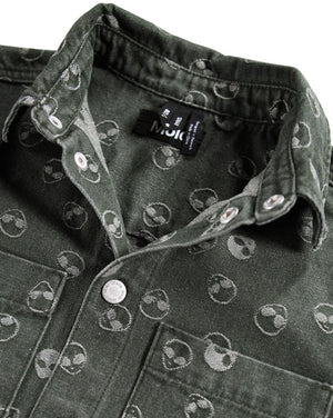 Dark denim jacket with alien pattern and visible brand label on a white background
