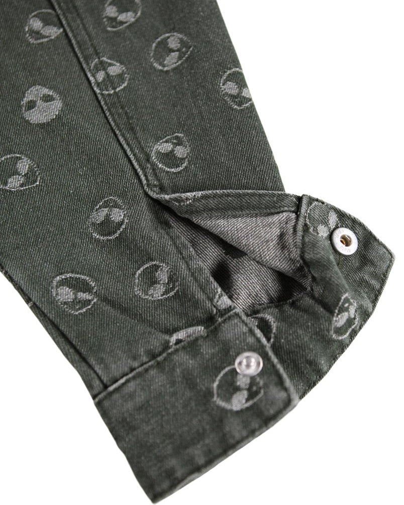 Close-up of dark gray fabric with circular patterns on a white background