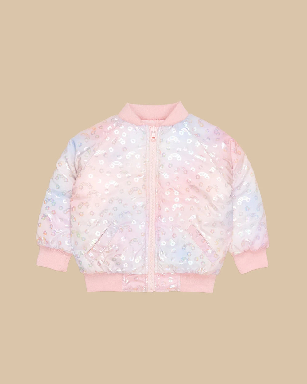 A reversible pink bomber jacket with a rainbow and floral pattern, featuring front pockets and a zipper down the front.