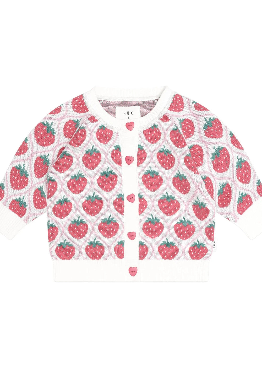 A baby cardigan sweater featuring a repeating strawberry pattern on a white knit background, with white ribbed cuffs, hem, and collar, and pink heart-shaped buttons down the front.