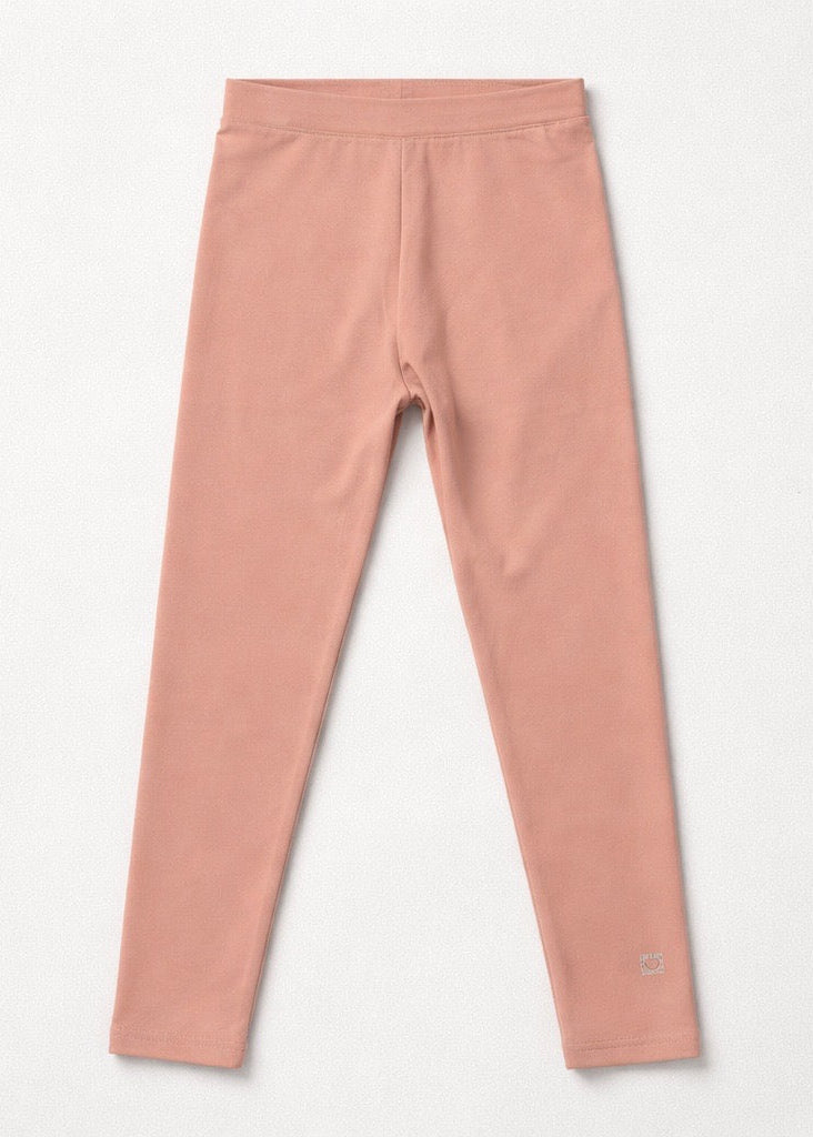 Pink leggings on a light gray background