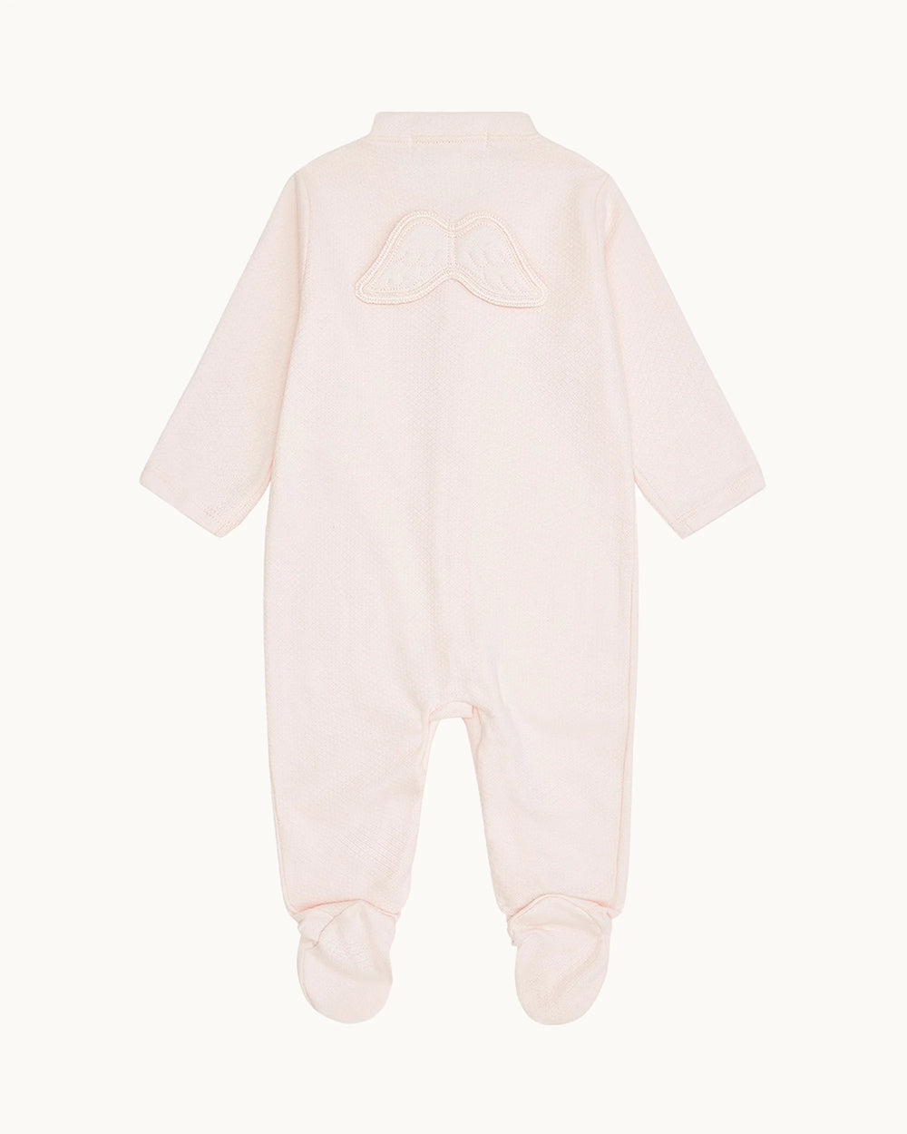 Pink baby onesie with a hood on a white background