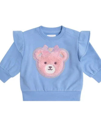 Blue sweater with a pink teddy bear design on a white background