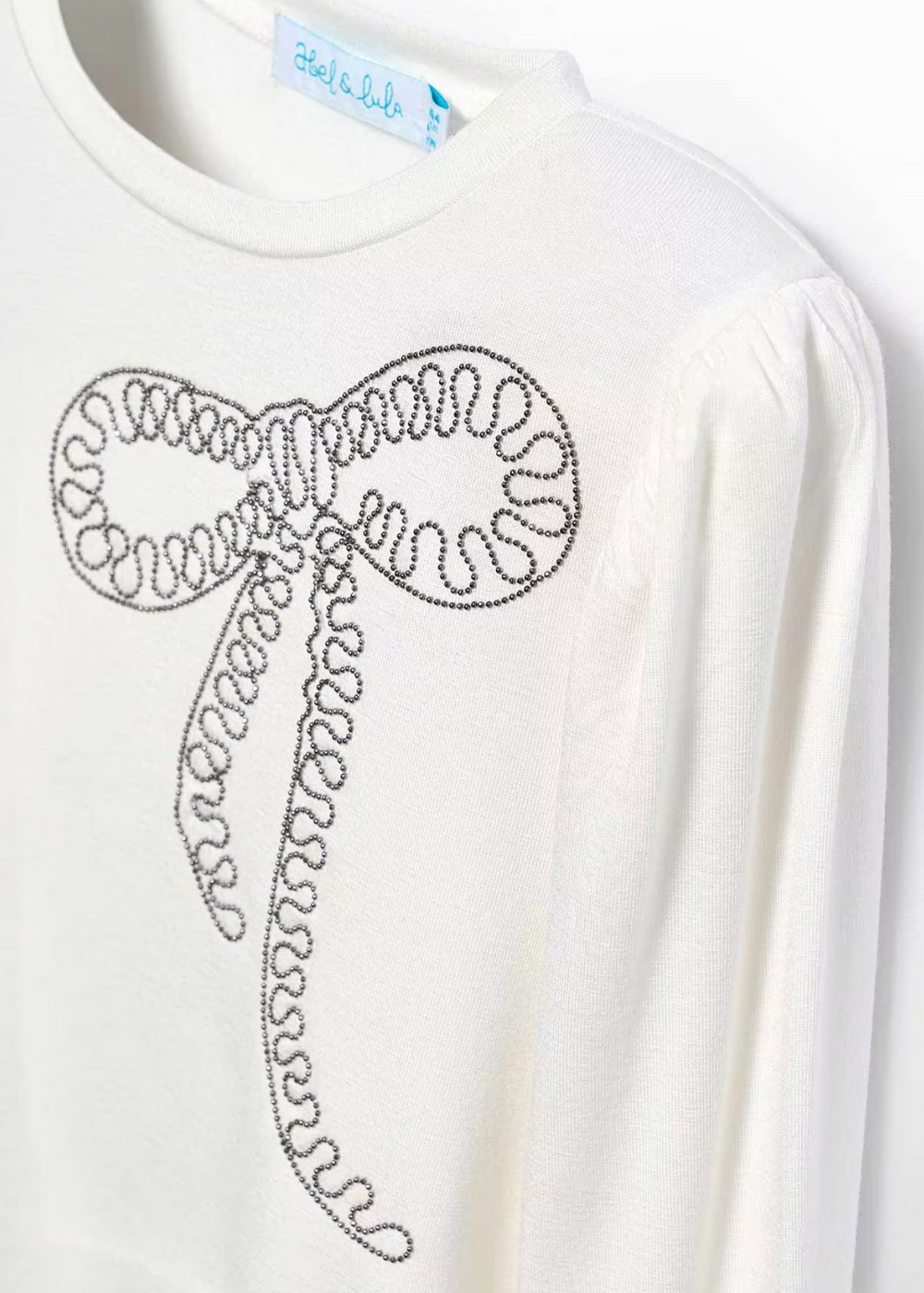 White sweatshirt with a decorative design on a white background