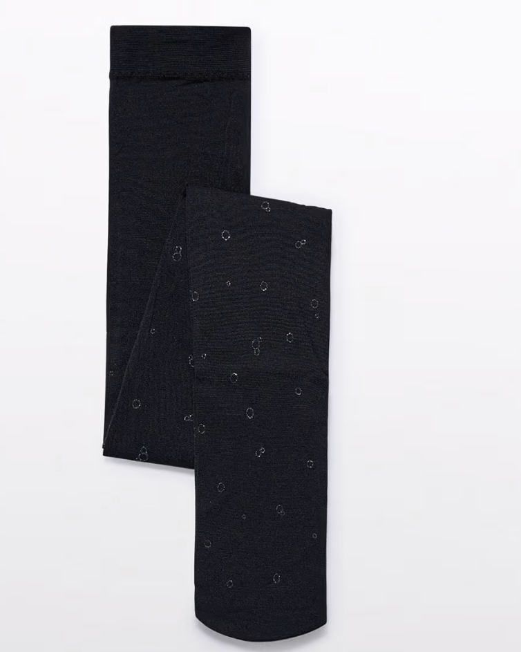 Two black socks with subtle patterns on a white background