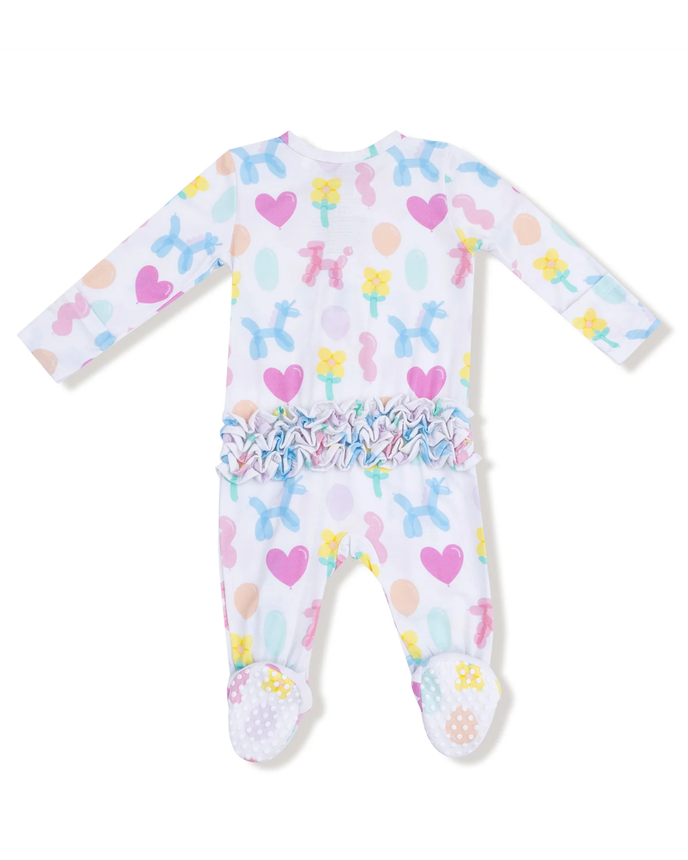 Baby onesie with colorful dog and heart pattern on a white background