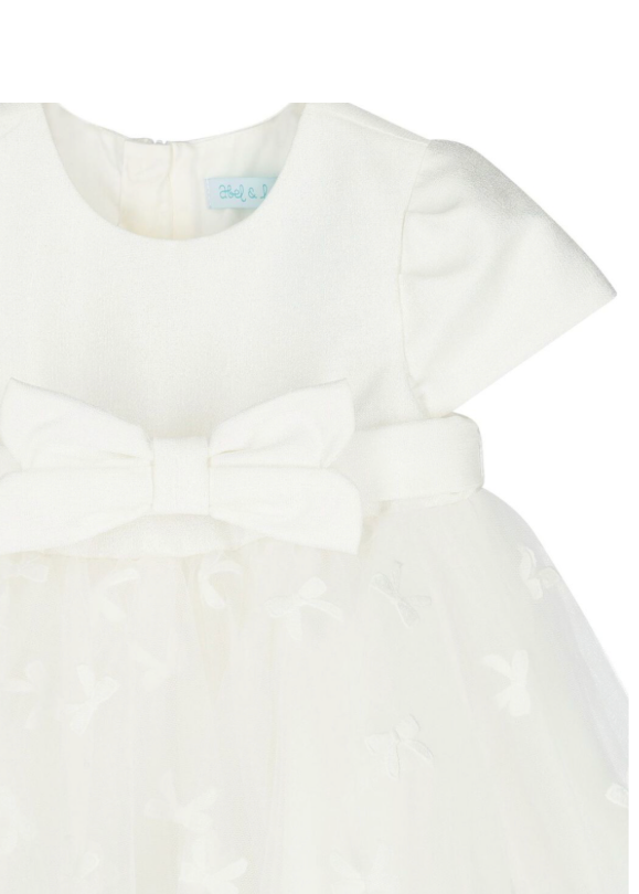White blouse with a bow detail on a white background