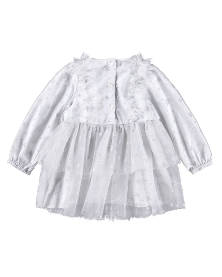 White dress with ruffled details on a white background