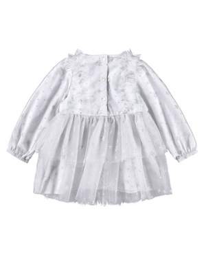 White dress with ruffled details on a white background