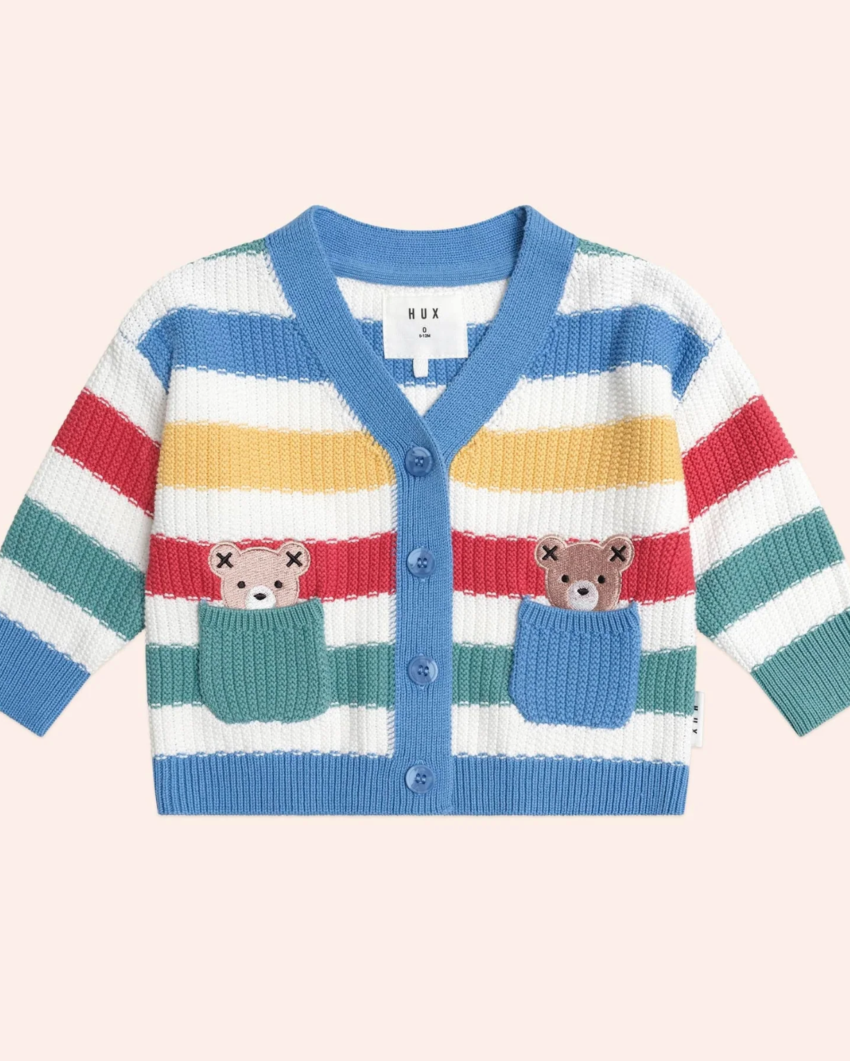 Colorful striped cardigan with teddy bear designs on a light pink background