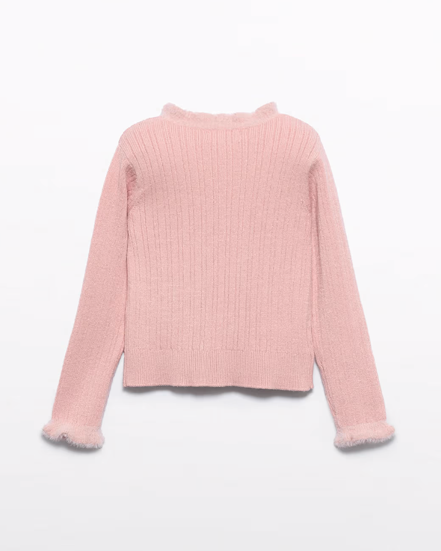 Pink ribbed sweater on a light gray background