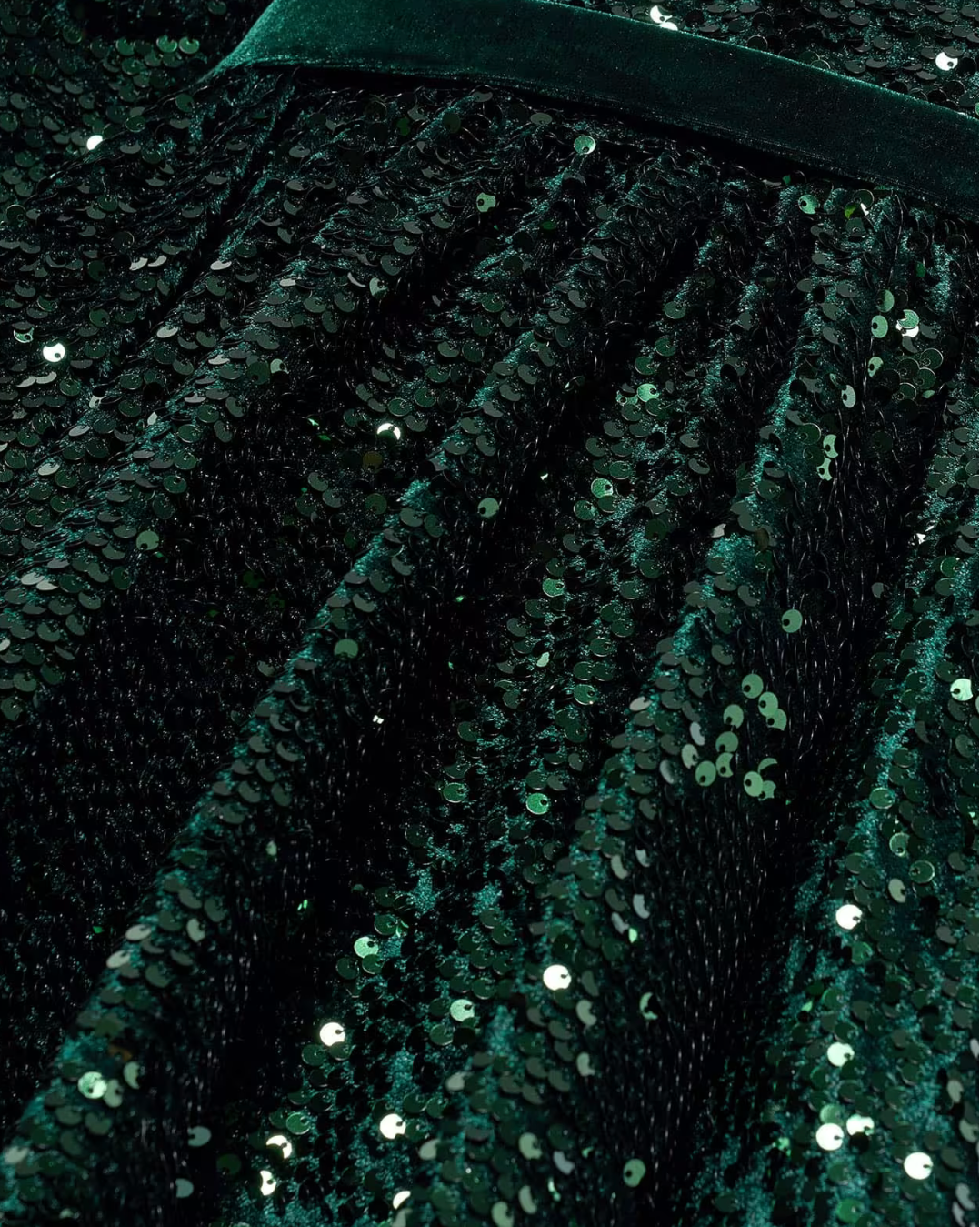 Close-up of a green sequined fabric texture