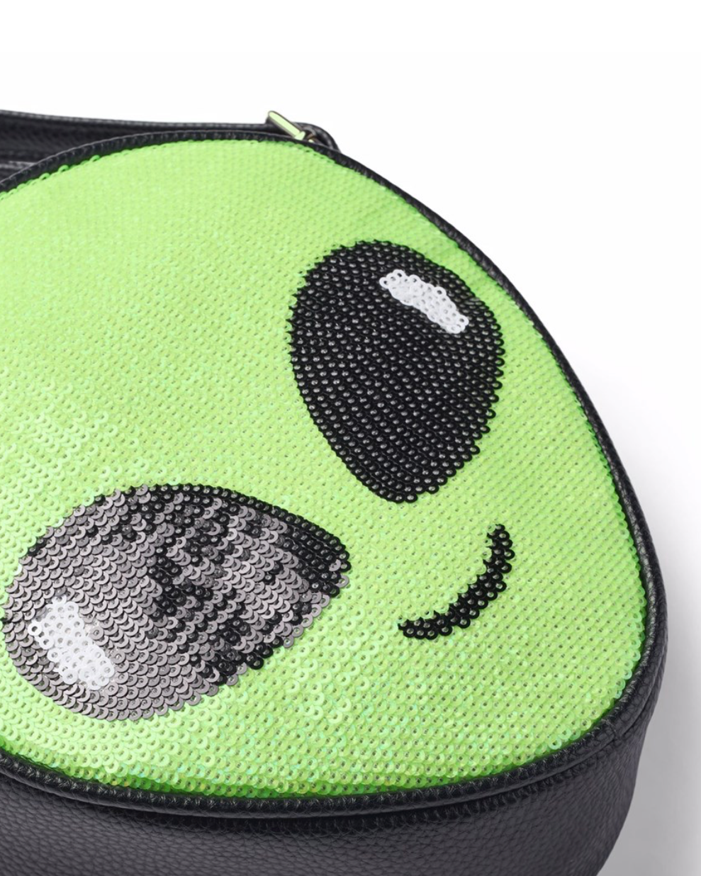 Green round pouch with alien face design on a white background