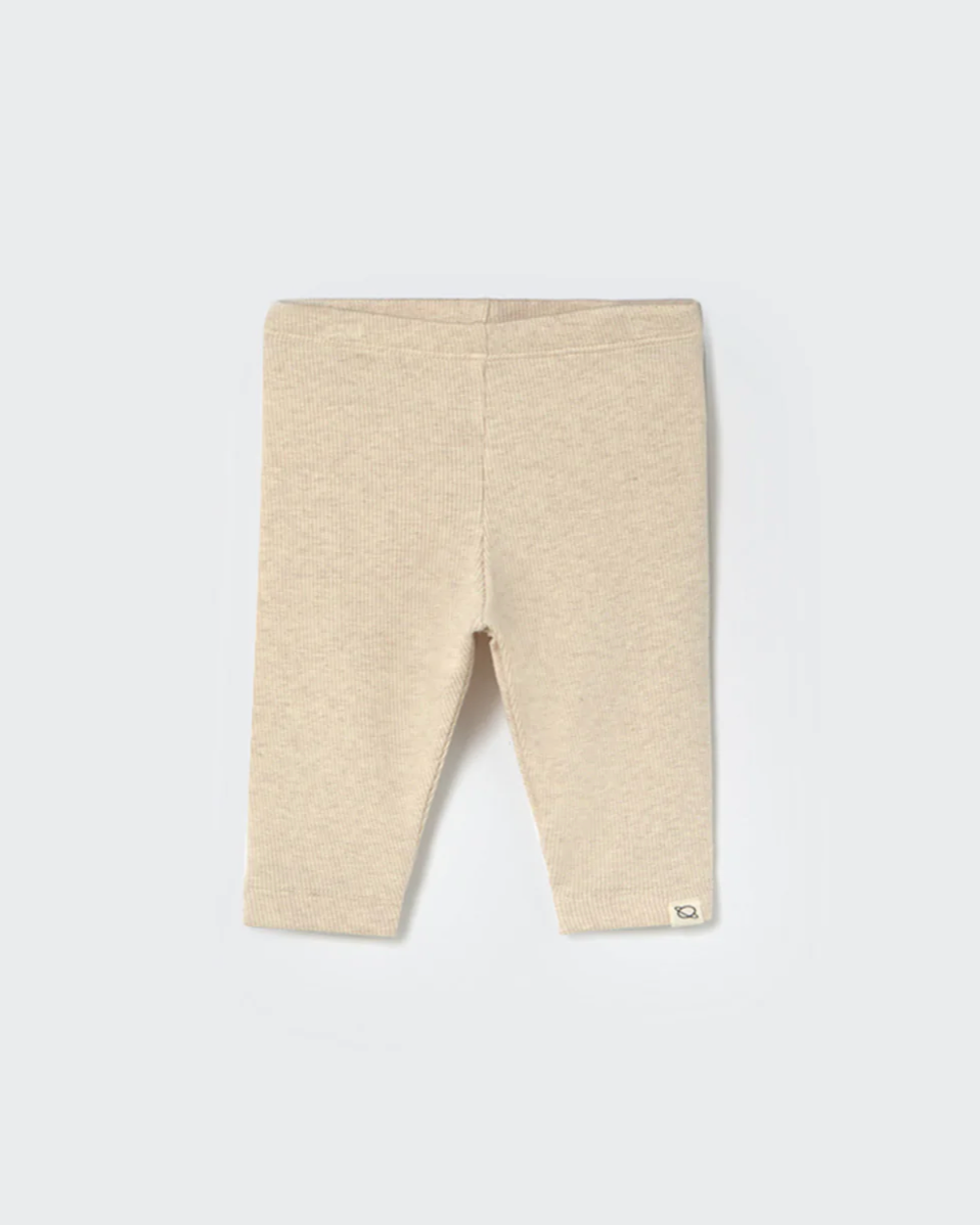 Beige baby leggings on a white background