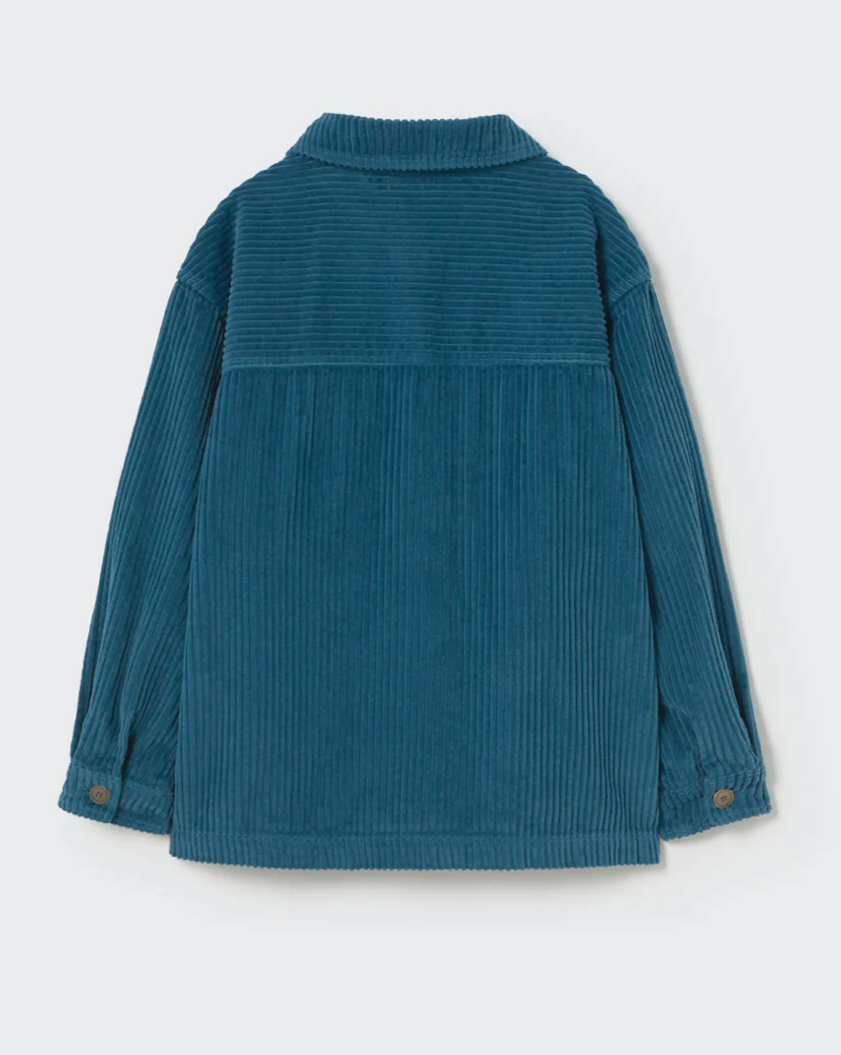 Blue corduroy shirt on a light gray background