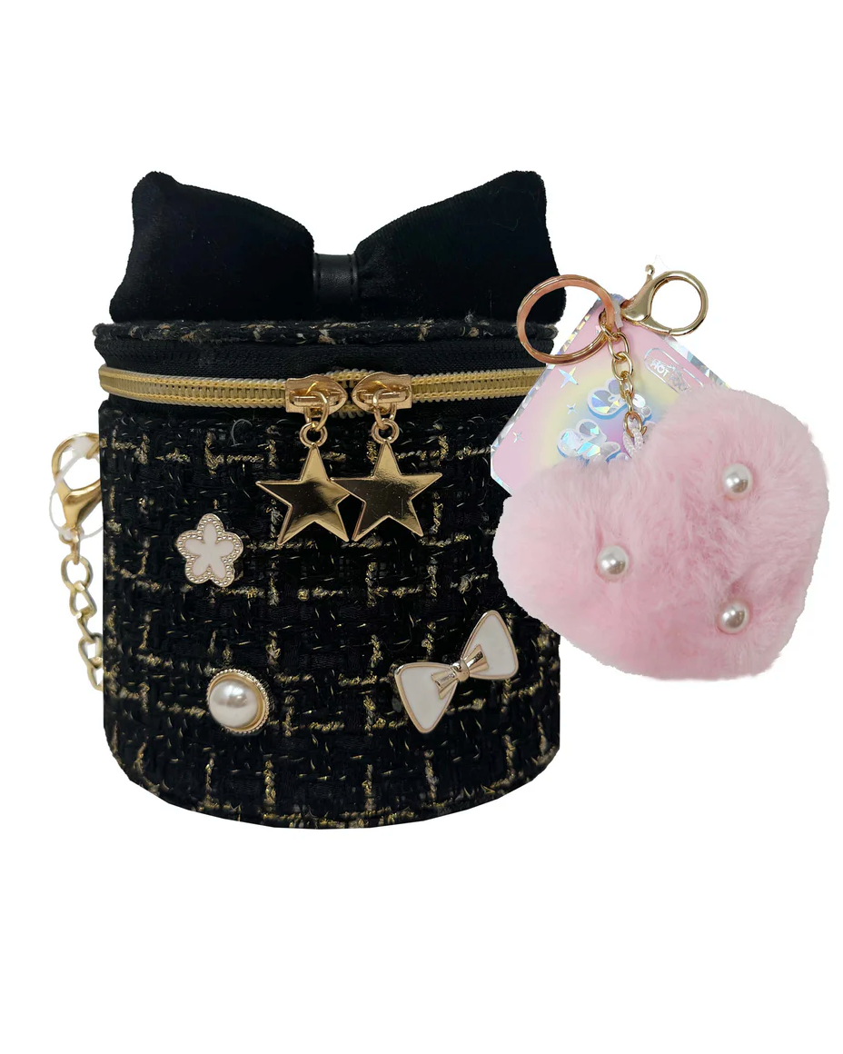 Black textured pouch with gold zipper and decorative charms, pink fluffy keychain with star and bow designs.
