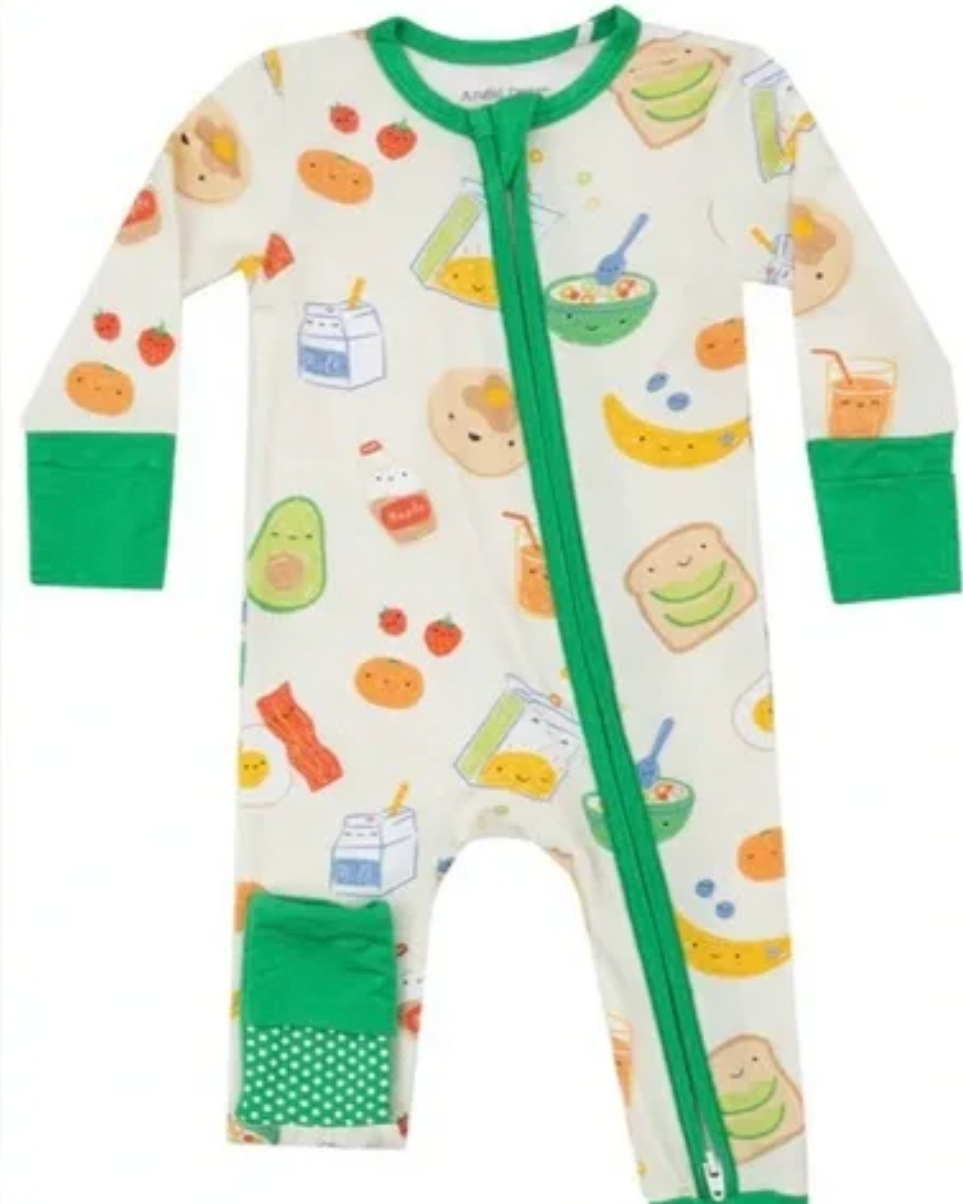 Baby onesie with colorful food print and green accents on a white background
